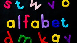 assorted color alfabet letters on black background